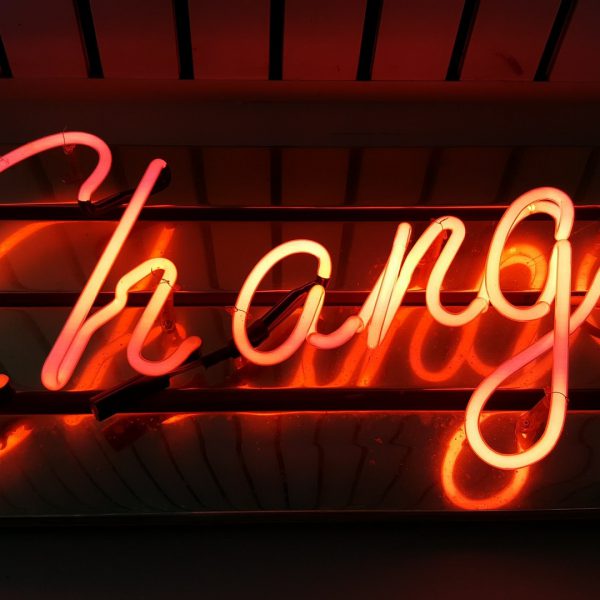 neon sign that says change
